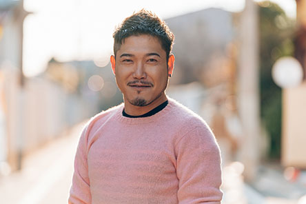 image of a young adult smiling at the camera